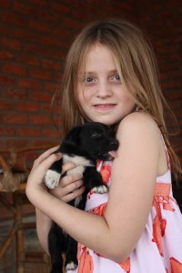 Jolie holding a puppy